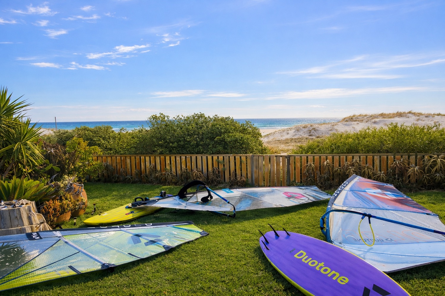 Kitesurfing and windsurfing gear on the lawn at 14 Penguin Place